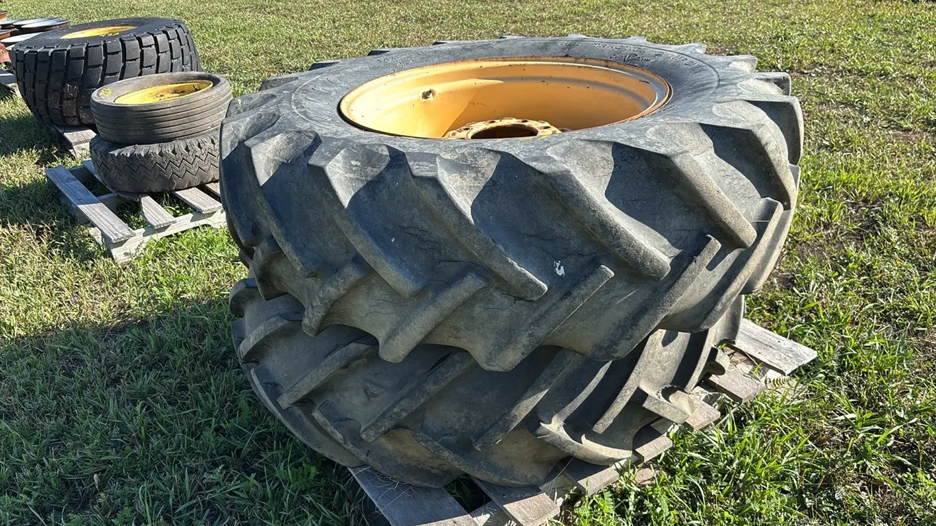 (1) Good Year and (1) Firestone 14.9-26 Lug Tire on 8 Bolt Hubs