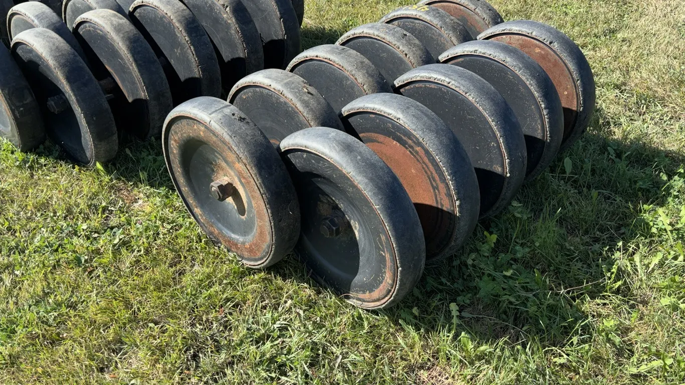 (1) 6 Wheel and (1) 5 Wheel Used 4" Rubber Packer Wheels