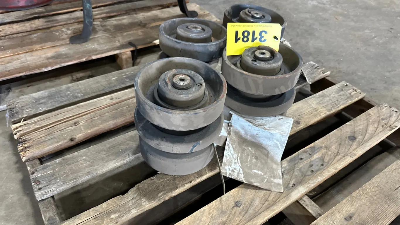 (4) Unused New Holland Track Idlers