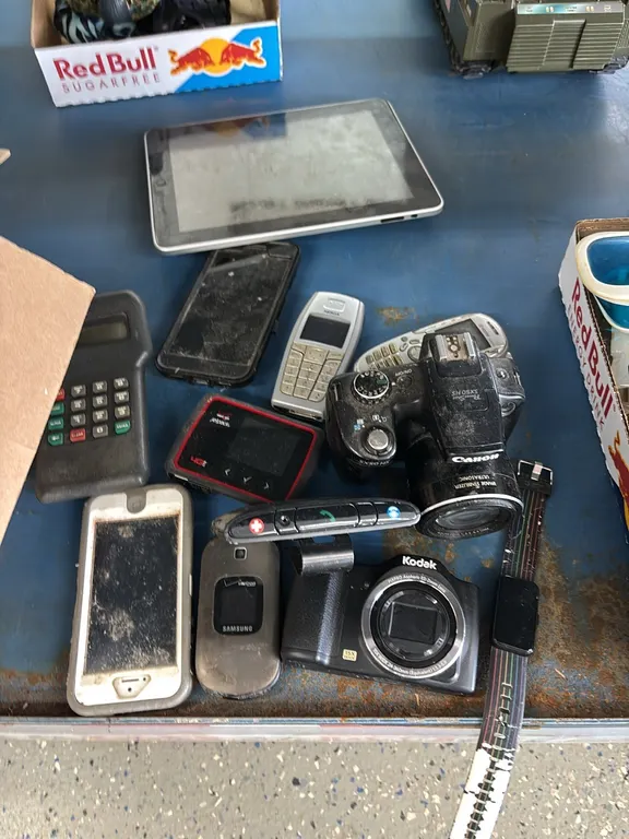 CAMERAS-OLD CEL PHONES-IPAD-JUSTICE WATCH-MISCELLANEOUS CORDS