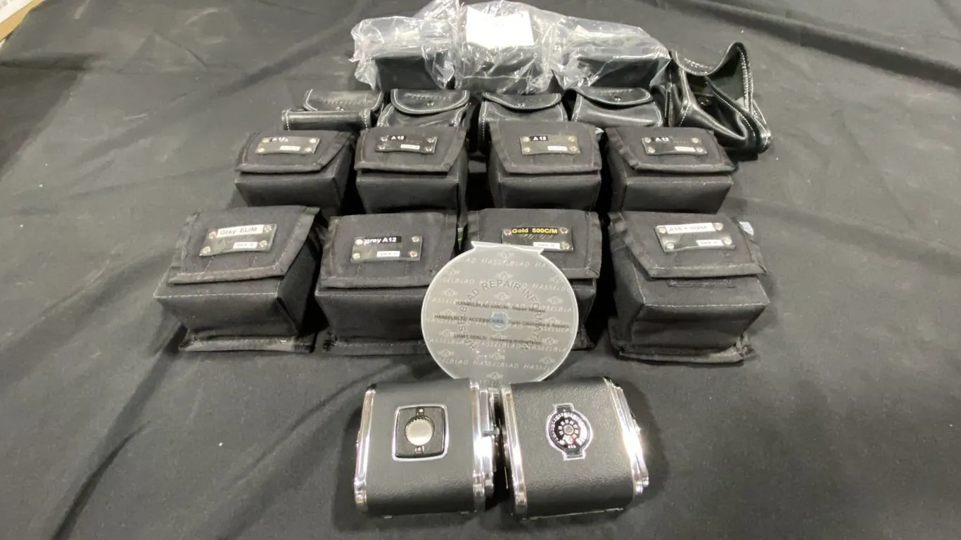 LARGE GROUP OF ASSORTED HASSELBLAD FILM BACKS & SOFT TRANSPORT CASES