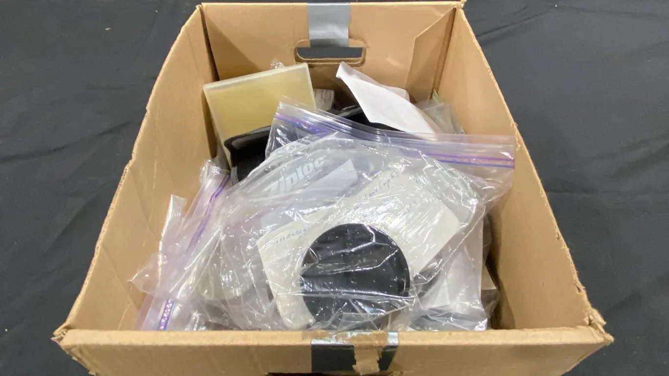 BOX OF ASSORTED FILTERS, WINDERS, LENS CAPS, BODY CAPS, EL FUSES, QUICK FOCUSING HANDLES & STRAPS