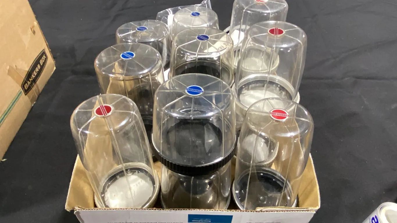 LARGE ASSORTMENT OF HASSELBLAD PLASTIC LENS STORAGE CASES