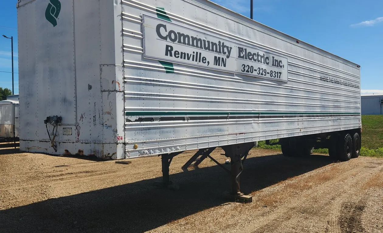 American Trailers Inc. 40' Semi Van Trailer w/roll up door, side door, steps, & shelving **CONTENTS DO NOT GO WITH**NO TITLE STORAGE TRAILER ONLY**