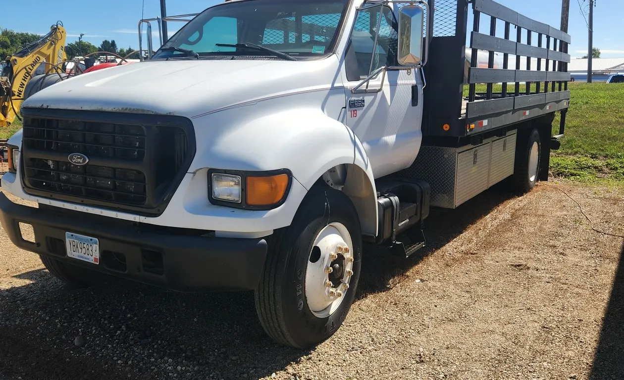 1999 Ford F650 Diesel Truck with stake side flatbed, toolboxes, & liftgate (New Batteries)