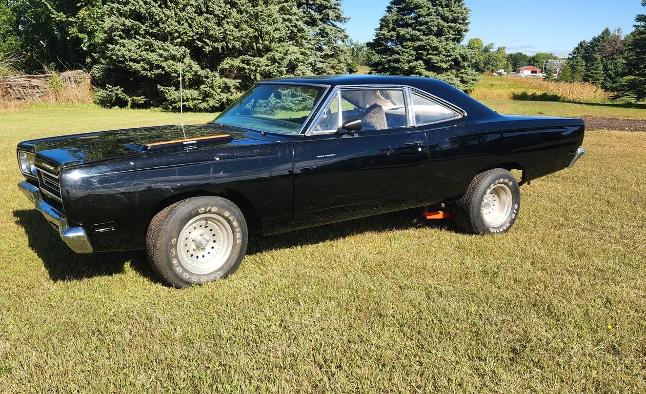 1969 Plymouth Road Runner Car *Driven into storage 8 years ago* We did not start the car, it will need fresh gas and carb cleaning. Motor turns over.