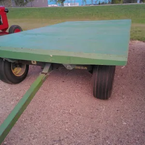JD 1065 Running gear w/wood flatbed