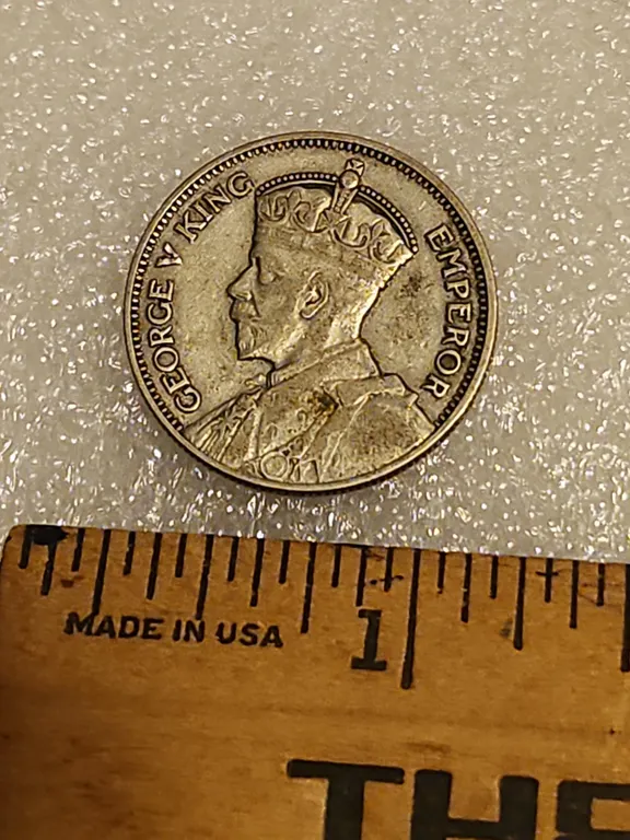 1934 King George V/Crouched Maori Warrior New Zealand One Shilling Silver/Copper Coin