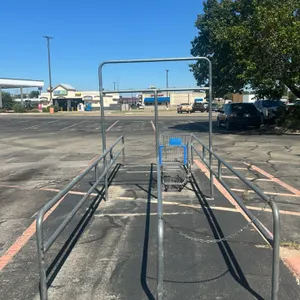 Metal shopping cart corrals. Features galvanized tubular construction, dual-lane cart return design, overhead sign arch, and chain closures. Dimension