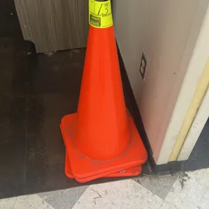 Polyethylene traffic cones. Features molded orange construction with square bases and stackable design.