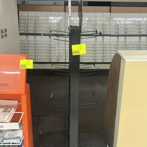 Two-sided multi-tier metal merchandiser display rack. Features Dave's Killer Bread branded graphic topper, adjustable wire display shelves, and hangin