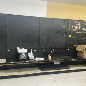 35'L of Lozier wall shelving. 84"H uprights with 19"D base shelves. Features black pegboard backing. Contents not included. Note: Sold by the foot.