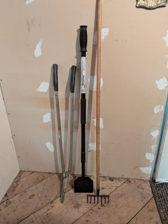 Garden Tools Rake, Clippers and and Chipper.