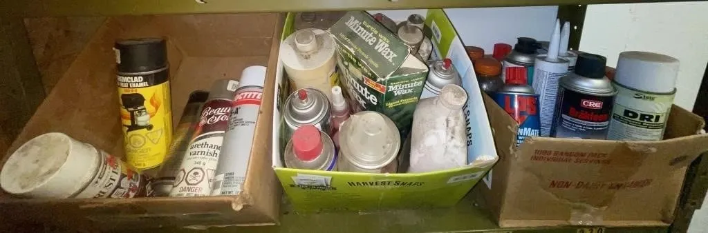 Three boxes of assorted cleaners, lubricants, and
