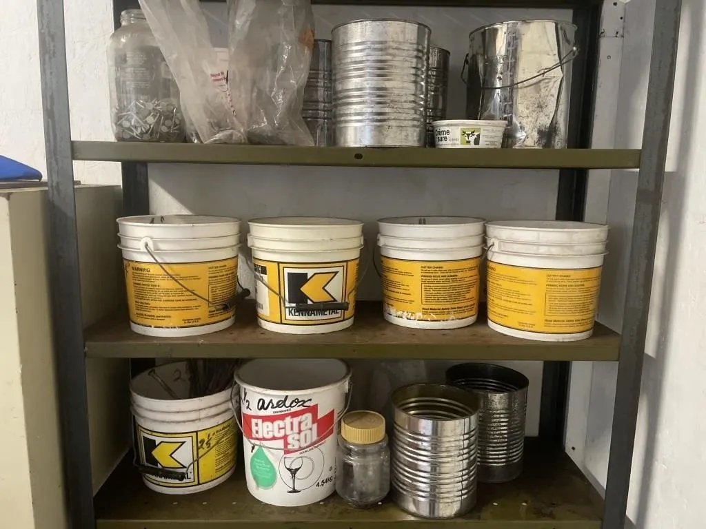 Three shelves of containers with a variety of