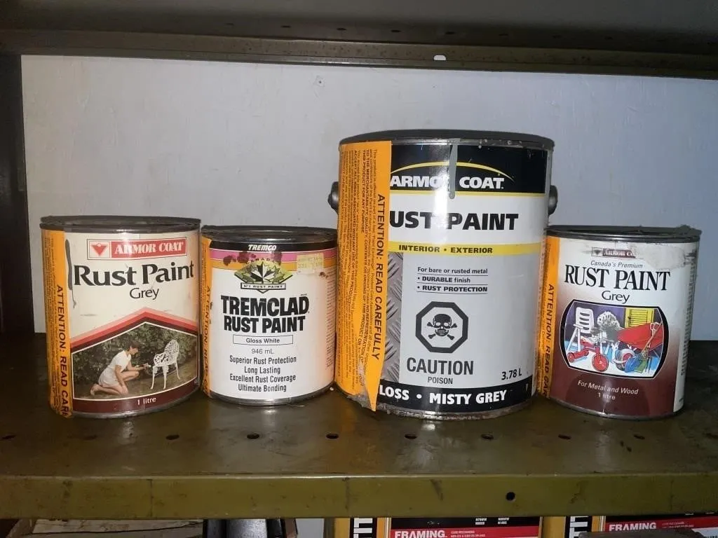 Four cans of rust paint.