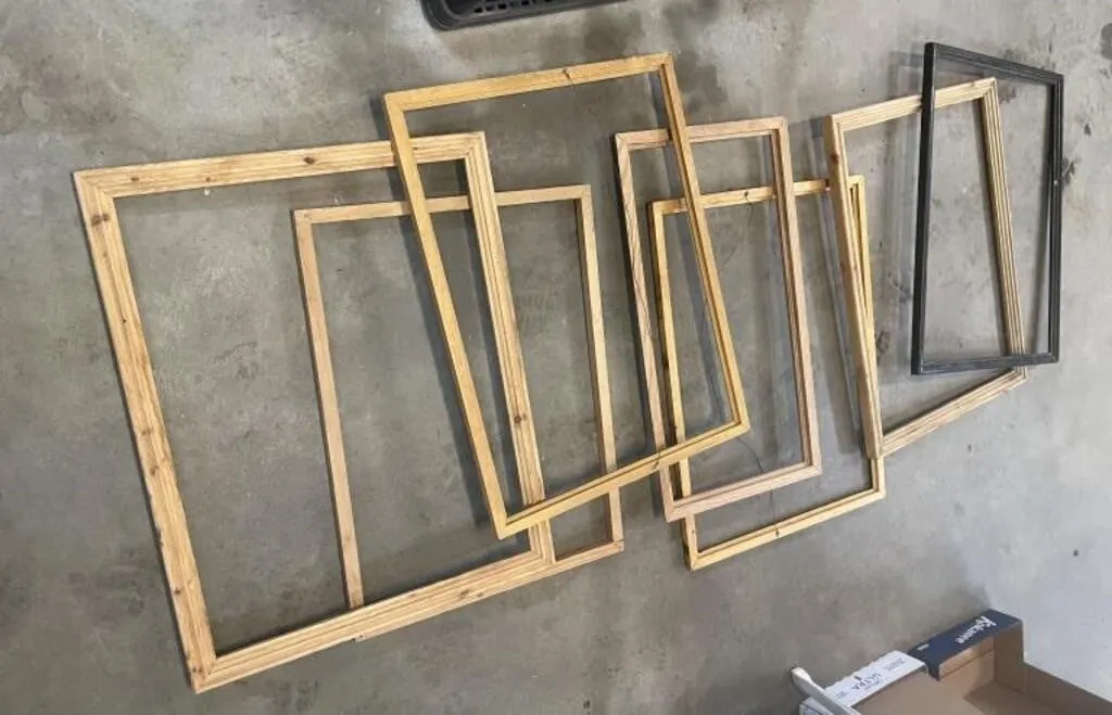 Seven wooden picture frames. Most are approx. 26�