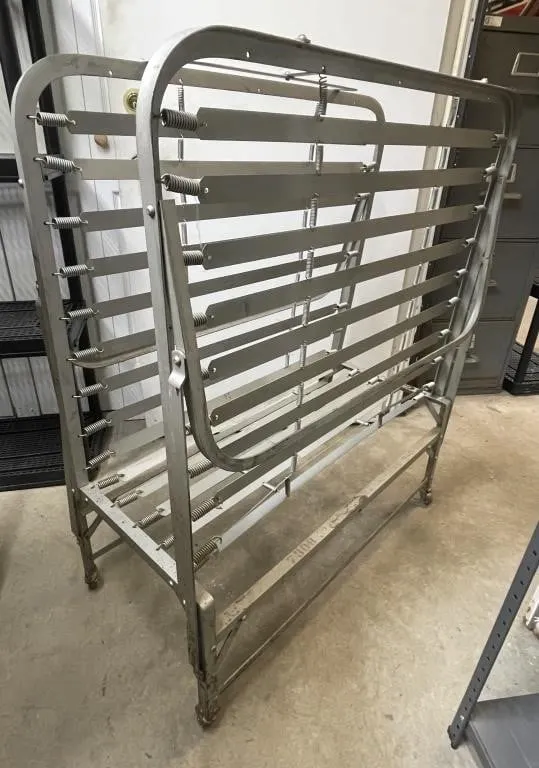 Vintage metal folding roll-away bed frame on