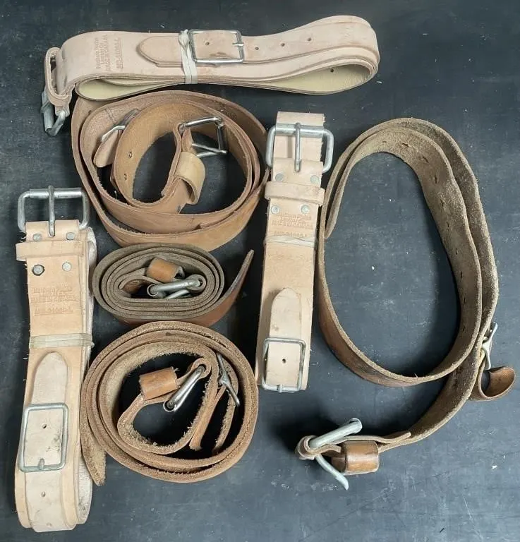 Seven new and used leather belts. Some are