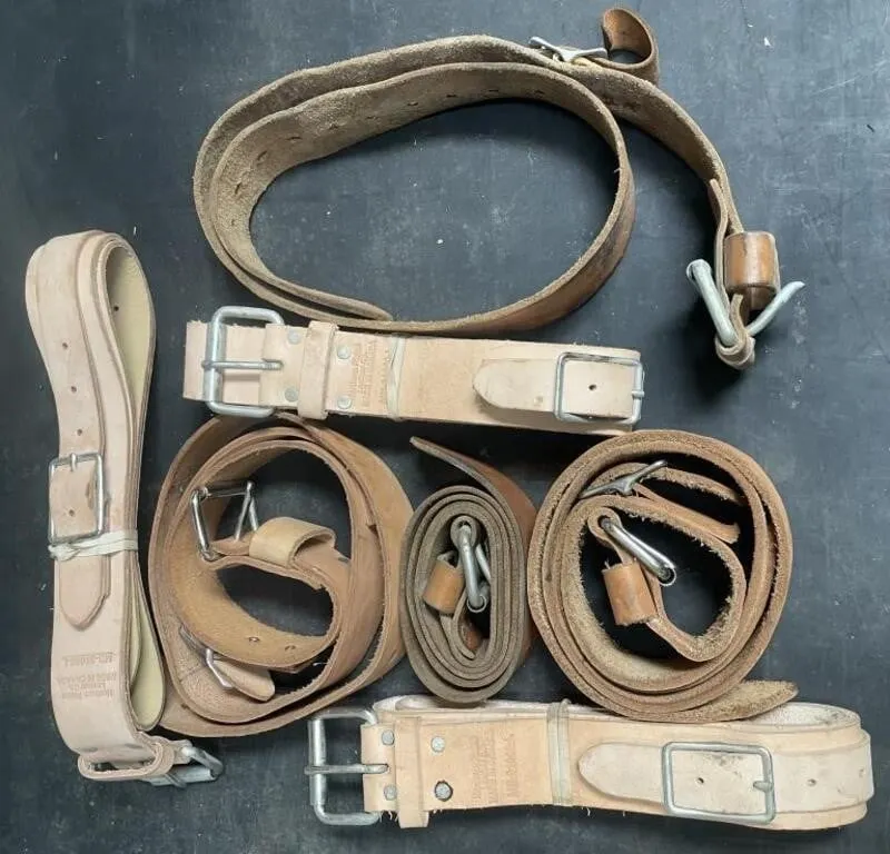 Seven new and used leather belts. Some are