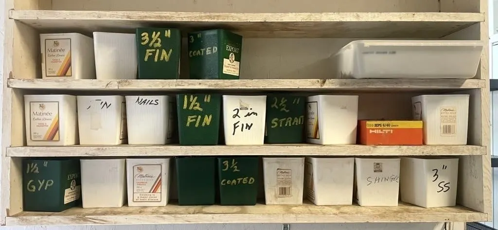 Assortment of nails in tobacco cans.