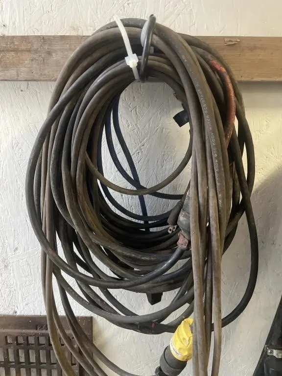 Four extension cords. Various lengths and gauges.