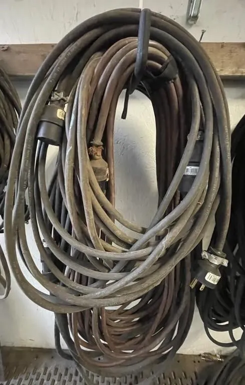 Four extension cords. Various lengths and gauges.