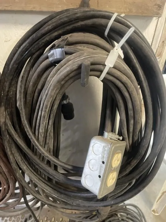 Four extension cords. Various lengths and gauges.