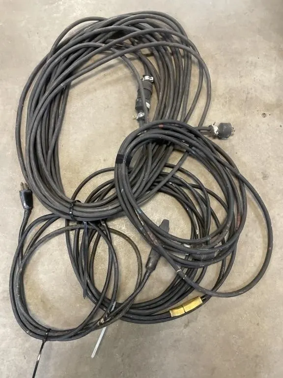 Four extension cords. Various lengths and gauges.