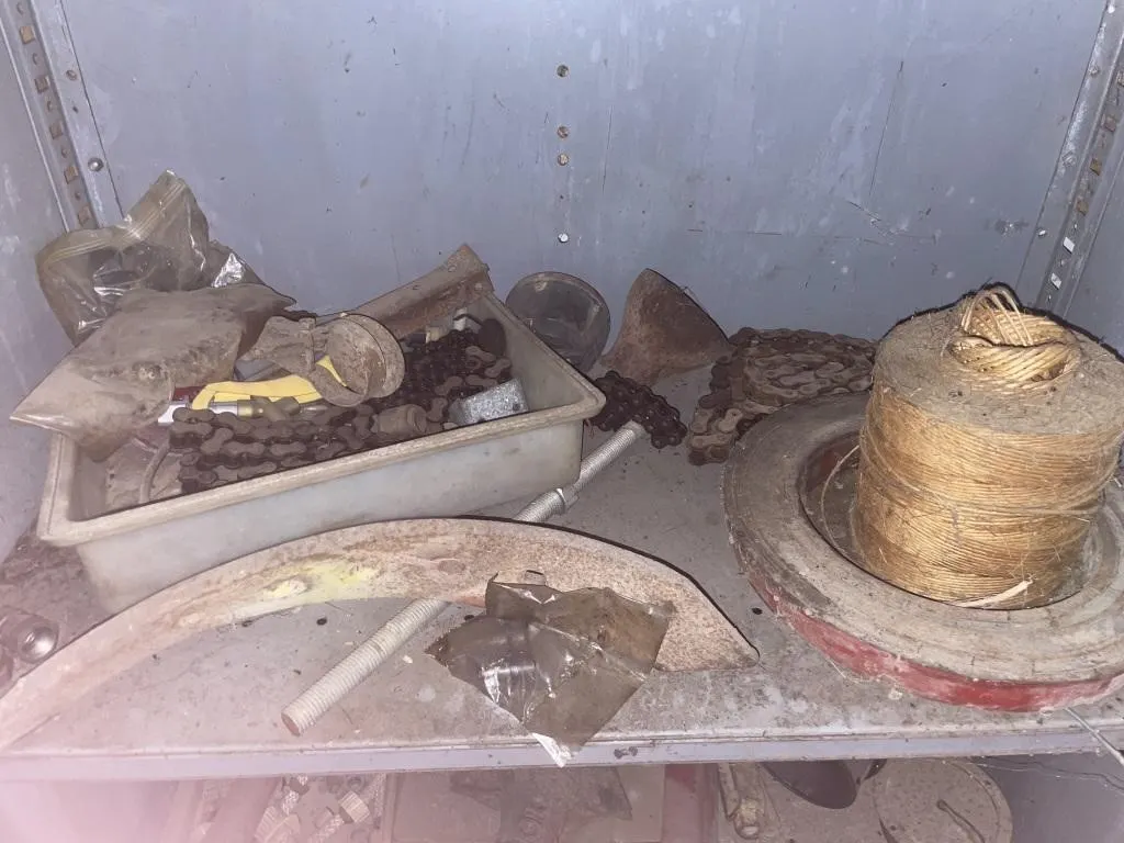 Contents of shelf - twine, tractor parts