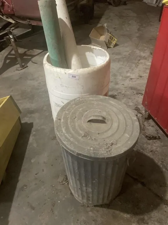 Galvanized trashcan, plastic barrel with contents