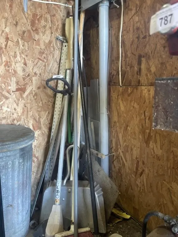 Metal yard sticks, weed trimmer, brooms, dustpan,