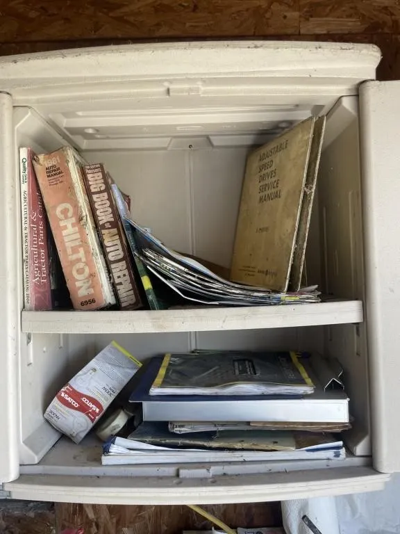Contents of cabinet - sandpaper and manuals