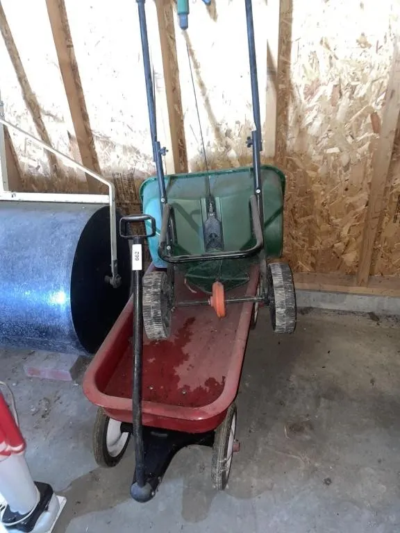 Radio flyer wagon with grass seed seeder