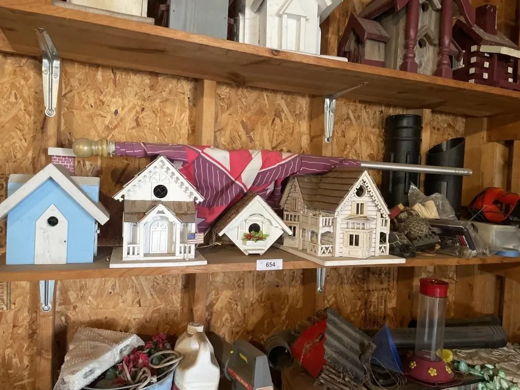 Contents of shelf - bird houses, wood decor, flag