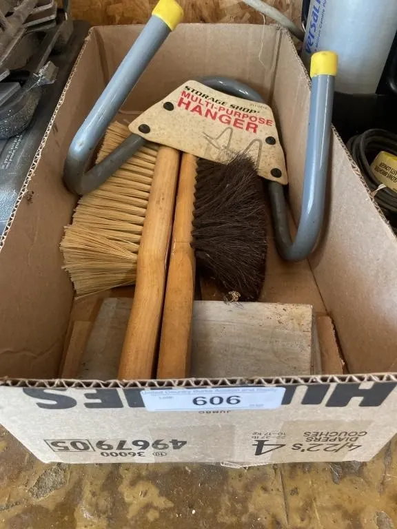 Hand brooms and tool hanger