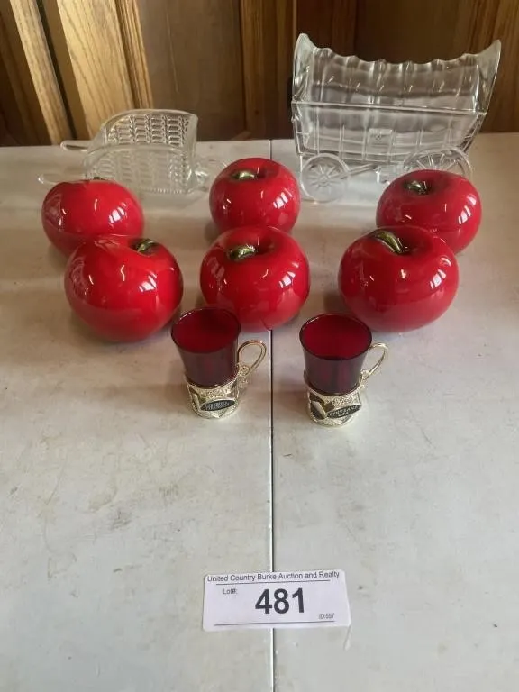 Glass wagon, wheel barrel, ceramic apples,