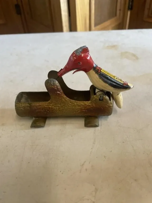 Metal woodpecker toothpick dispenser