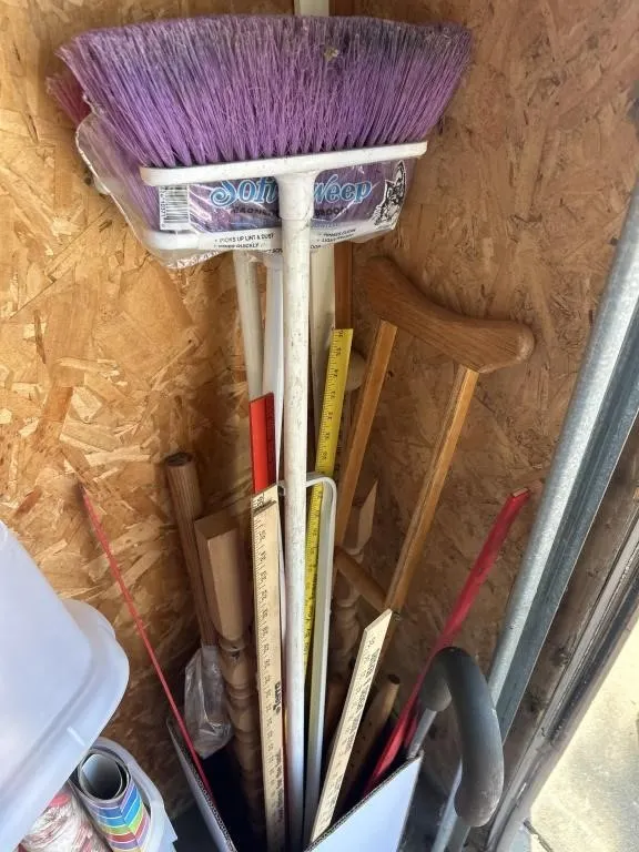 Brooms, yard sticks, crutch