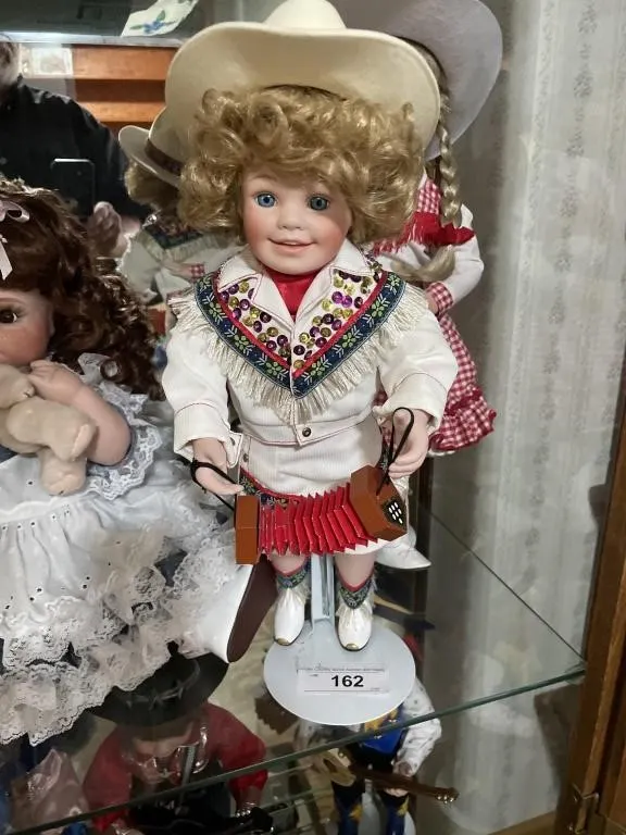 Ceramic western girl doll with accordion