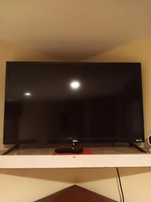 32" Onn TV with Roku Remote. Powered on 2nd