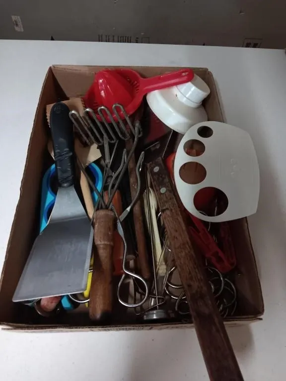 Assorted kitchen utensils. Spatula, tongs, and