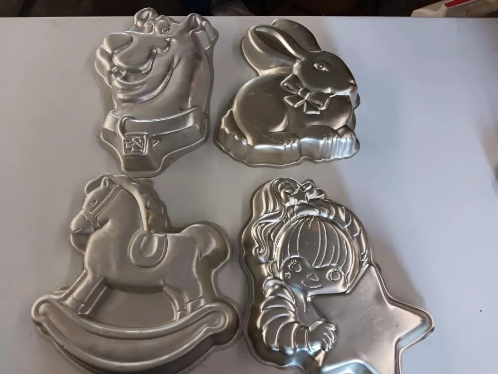 Wilton cake pans. Including Scooby -Doo and