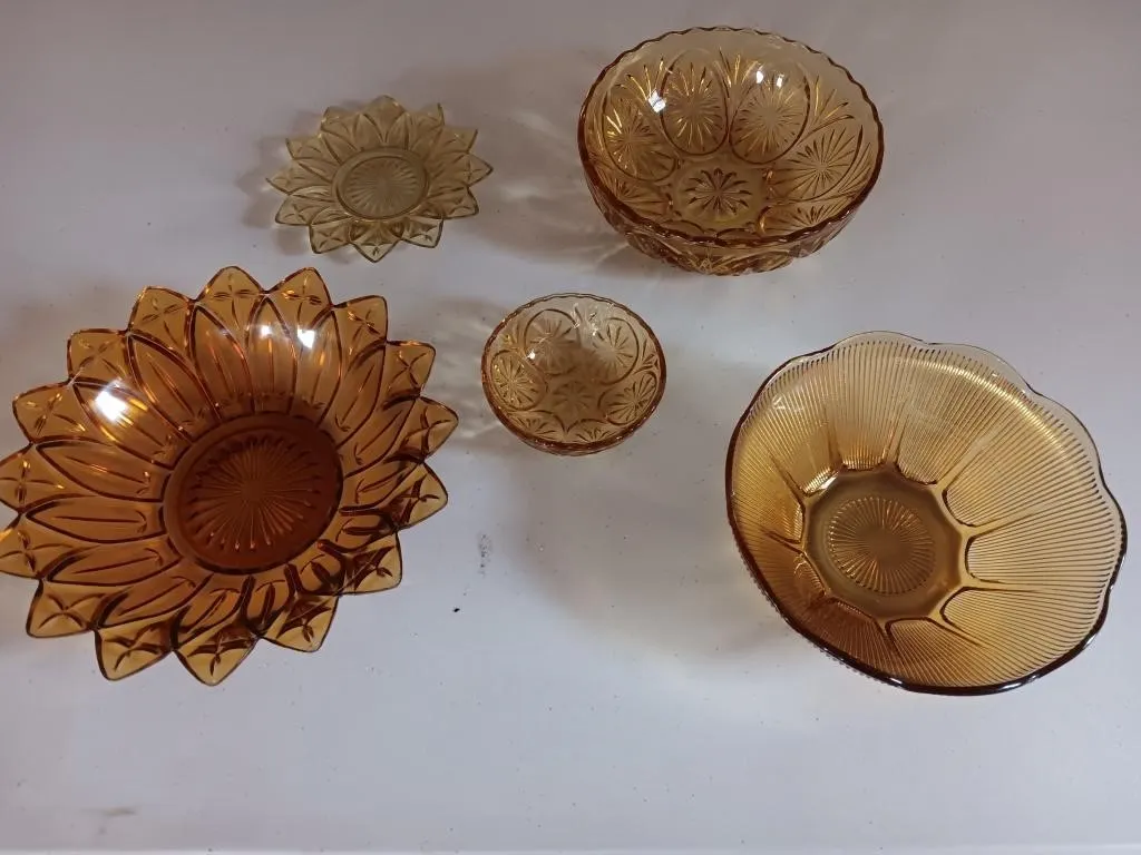 Amber glass bowls .
Measurements. Approx. 10" in