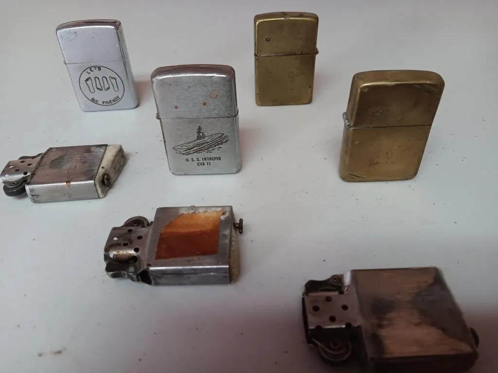Assortment of Zippo lighters.
U.S.S. INTREPID,