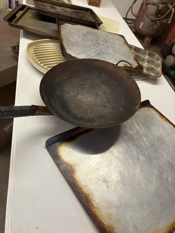 Assortment of baking sheets, Wok, and more