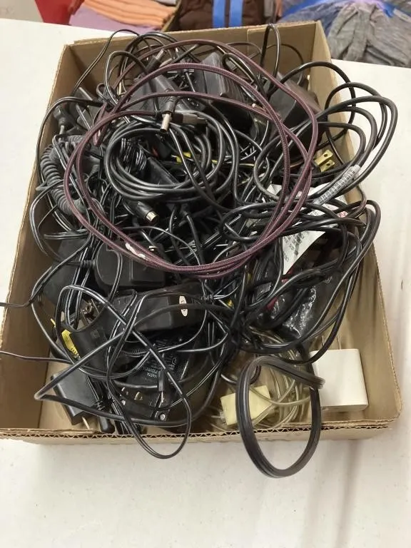 Assortment of ac adapters, charging cords