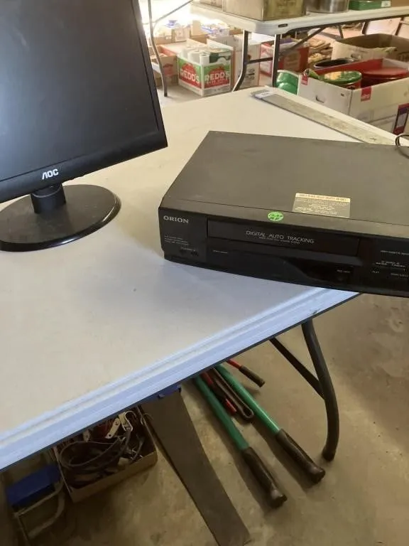 Orion VHS player powered on & AOC monitor no cord