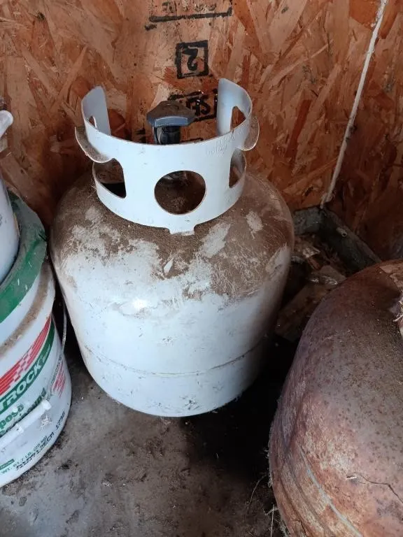 20lb propane cylinder. Appears to be empty.