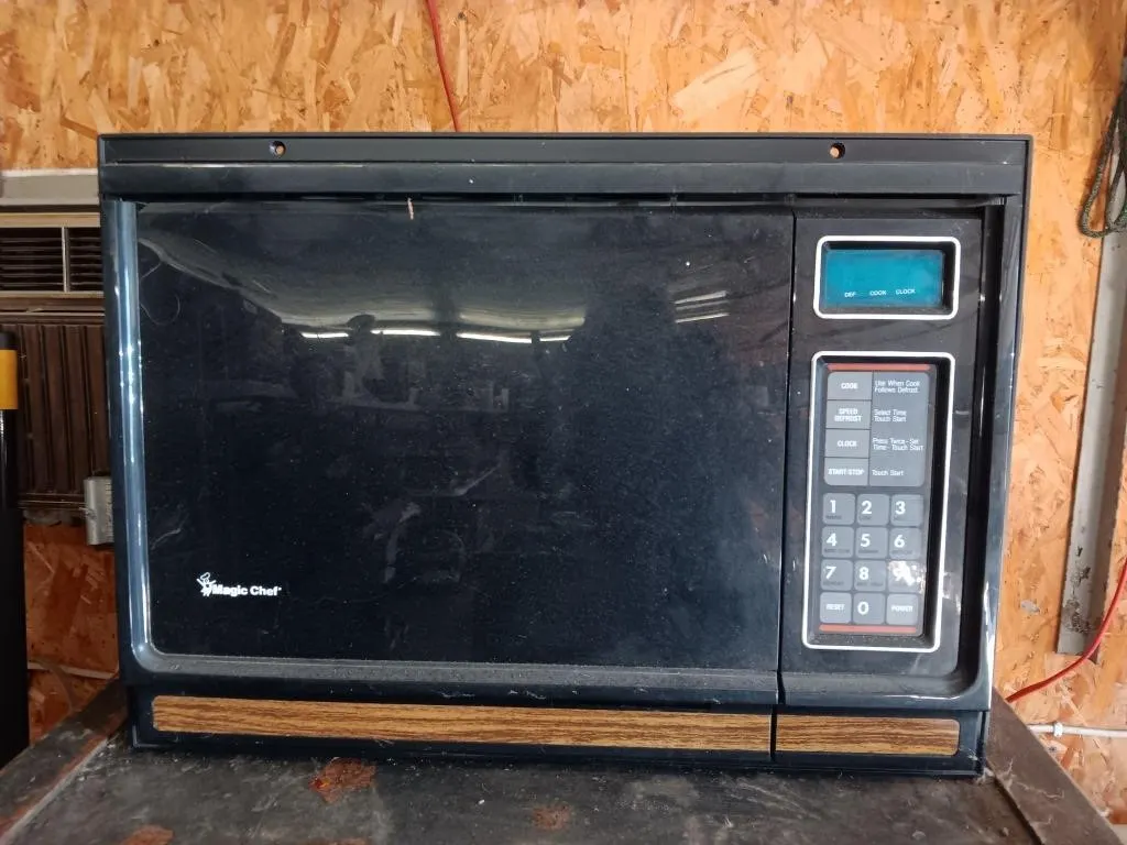 Magic Chef microwave oven.
(Powered on at